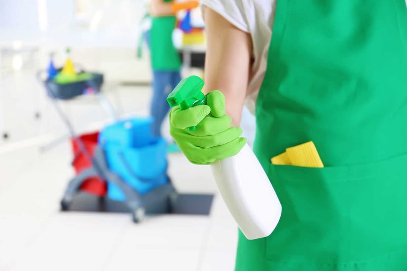 Disinfectant spray by cleaning lady